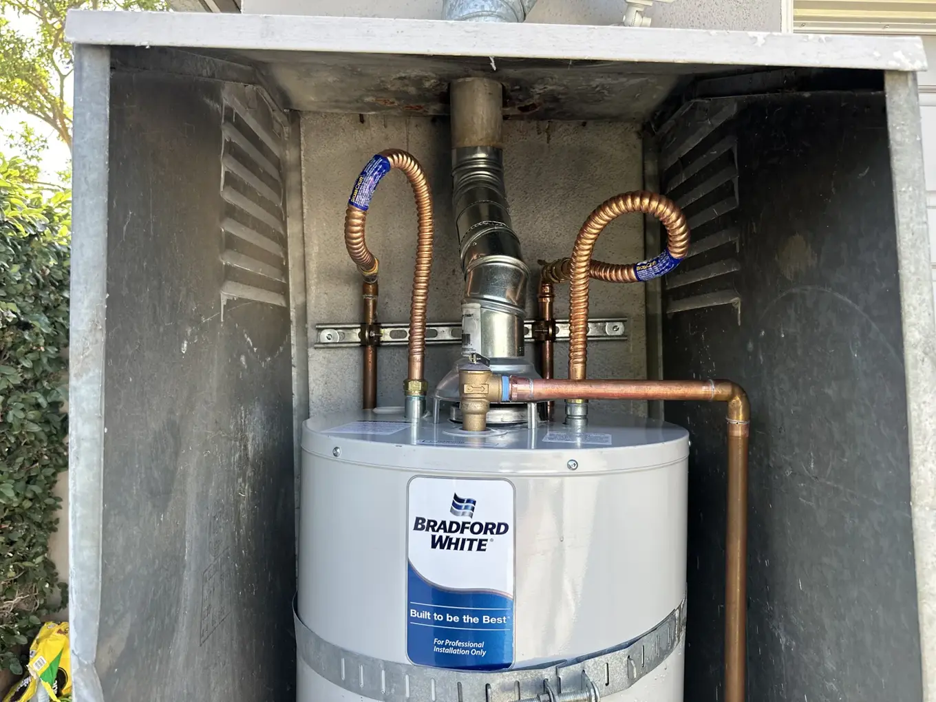 Crew delivering a replacement tank water heater